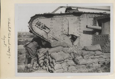 A derelict tank used as a roof of a dugout, 1915-18 by English Photographer